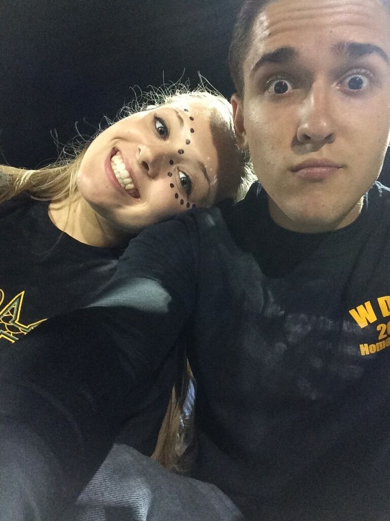 Our first time "hanging out" together. Friday Night West Davidson football game! (Yes, that is Julia's handprint on Jacob's shirt!)