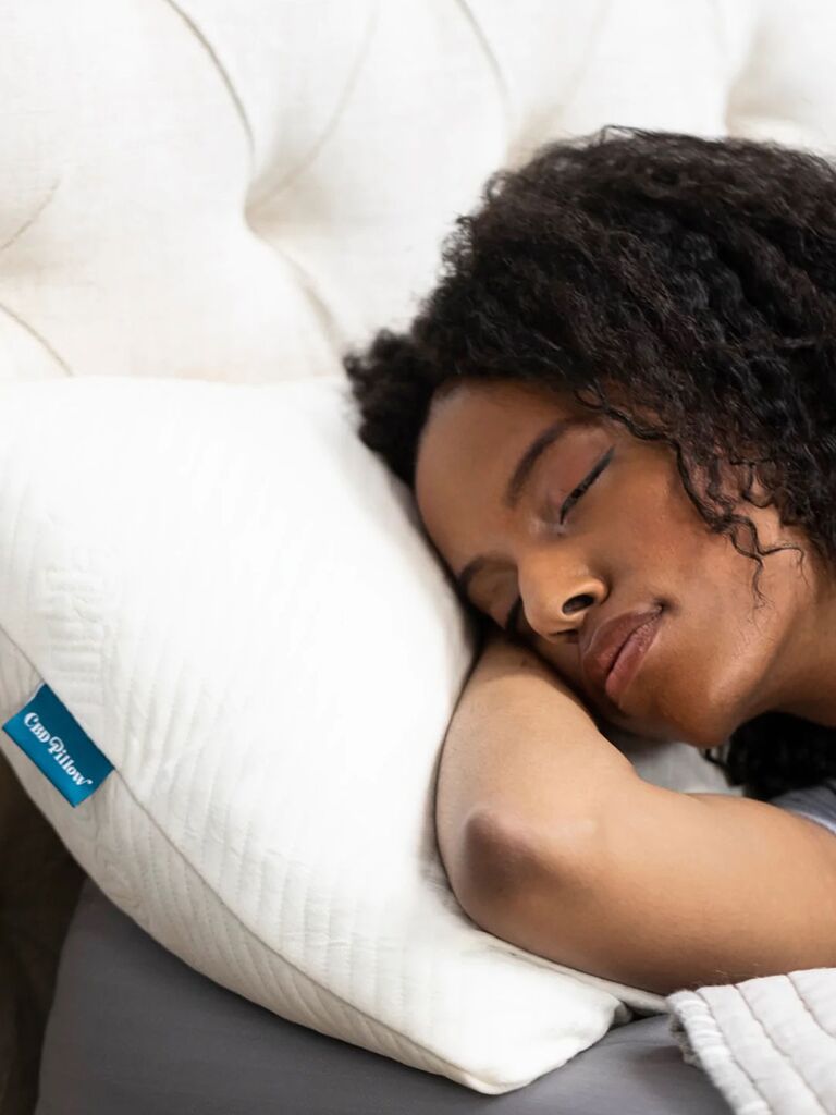 Woman using stress relief CBD pillow