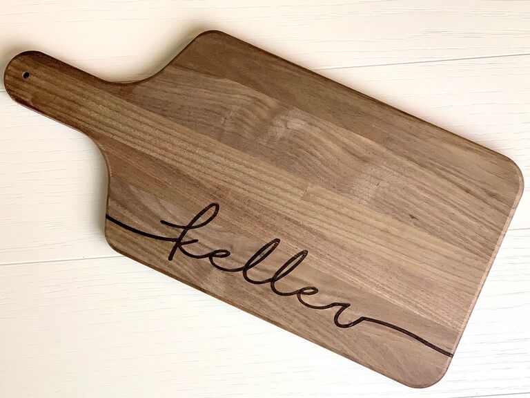 Sleek wooden cutting board featuring a personalized name engraving. 