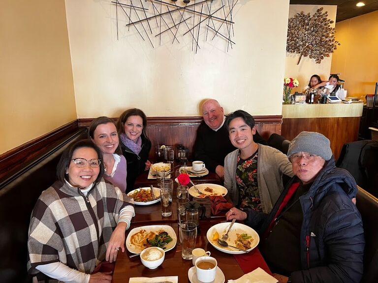Families coming together over Thai food after choosing our venue!