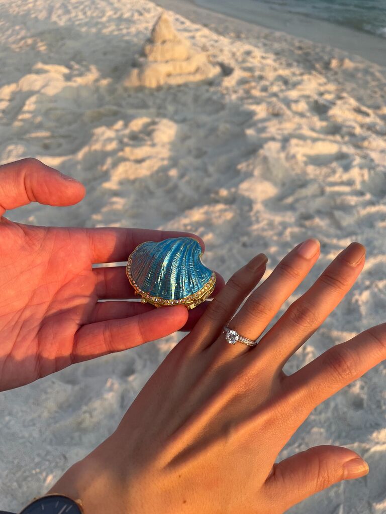 Elaine (Nick's mom) came up with this wonderful maritime concept for a ring holder - a beautiful, blue sea shell. Needless to say - Juju said yes!!!