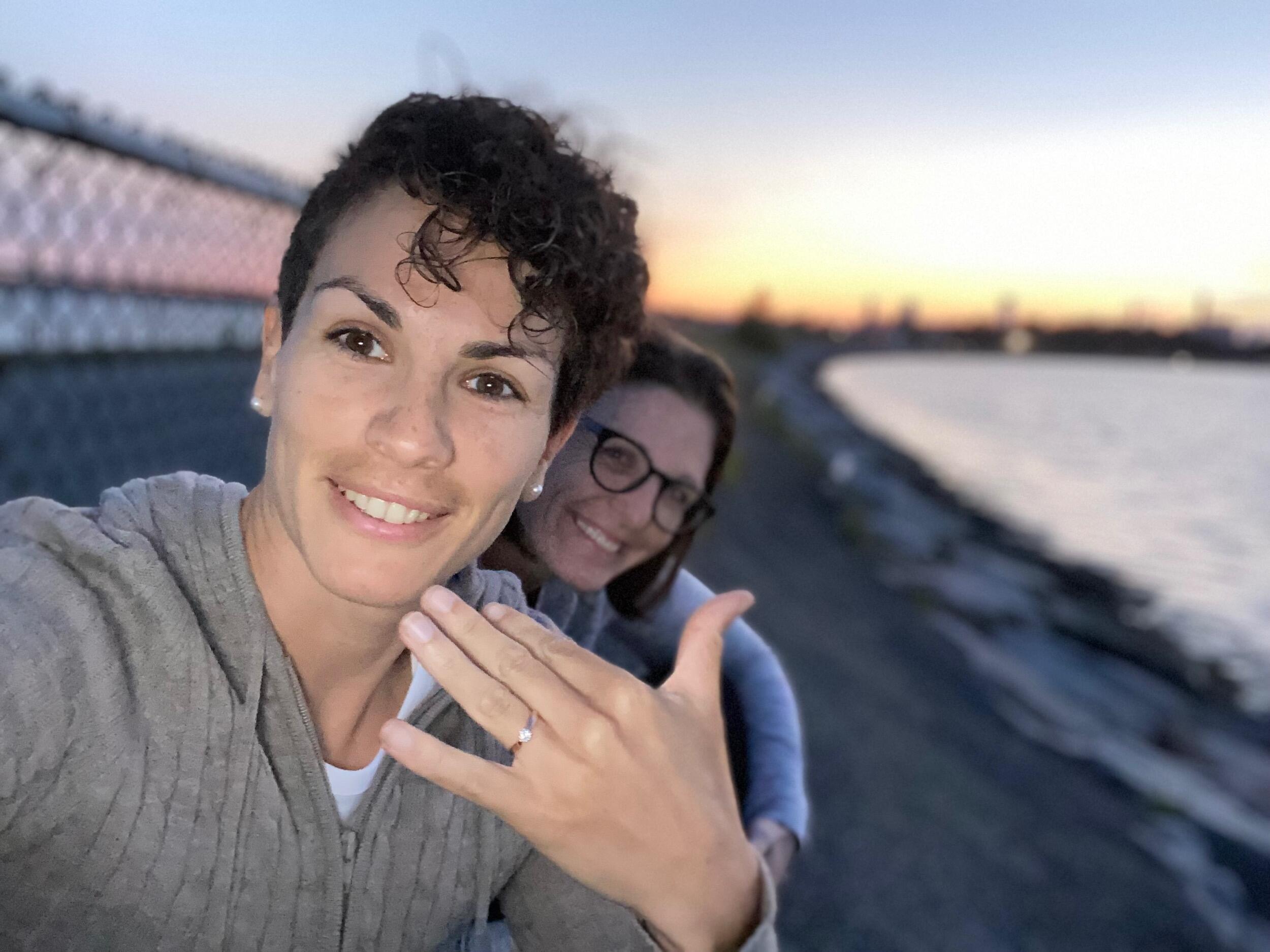 With one last day in Boston... Allison decided to propose at one of Kelly & Allison's other favorite spots to watch a Boston sunset... Castle Island in Southie! Allison pulls out the ring on its own... and kelly puts the ring on as fast as possible... out of fear the ring may fall in to the rocks... she then said yes. 