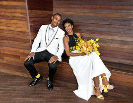 modern black and white wedding attire with yellow bouquet