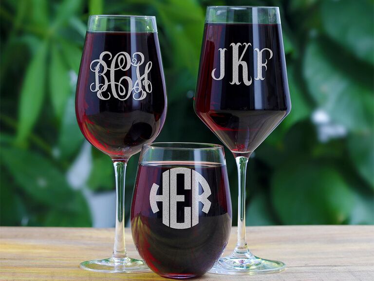 Stemless and stemmed wine glasses with bold silver monogram