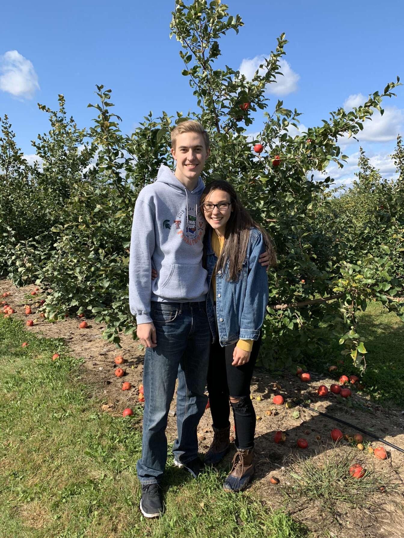 We started dating our senior year of high school! This picture is from our very first date at an apple orchard. We met in study hall, where not much studying took place. We sat at a table with some friends and played cards most days, that's where it all began!