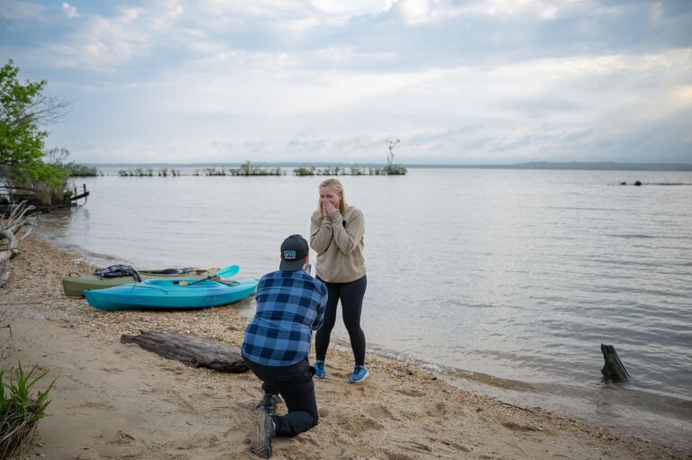 Philip planned a kayaking date back to our first date spot, Mallows Bay. 
Christina was suspicious and kept a close eye on Philip.  Philip told Christina to turn around and face the water, he quickly grabbed the ring, and when Christina turned around he was down on one knee! After a rush of emotions, Christina said YES! 