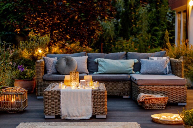 backyard area with couches and candles