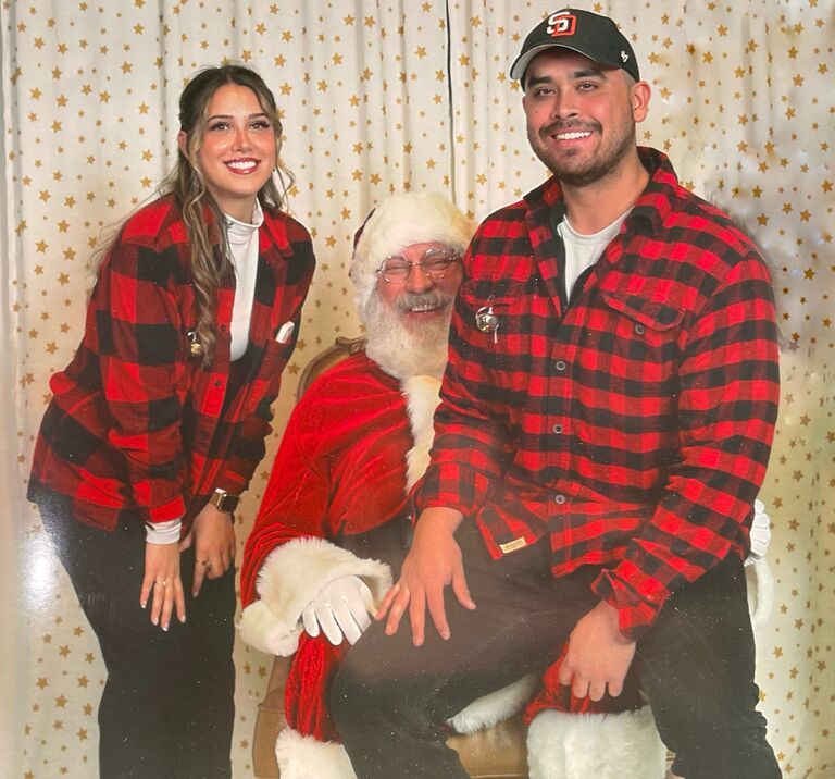 Serving together for the holidays at church! Yes that is Kyle sitting on Santa's lap. Big boys need love too. 