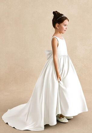 Mimia is our classic matte satin flower girl dress. She features a scoop neckline, a V-back with a bow tie, and a pleated A-line skirt flowing into a chapel train. She is the perfect dress for your flower girl.