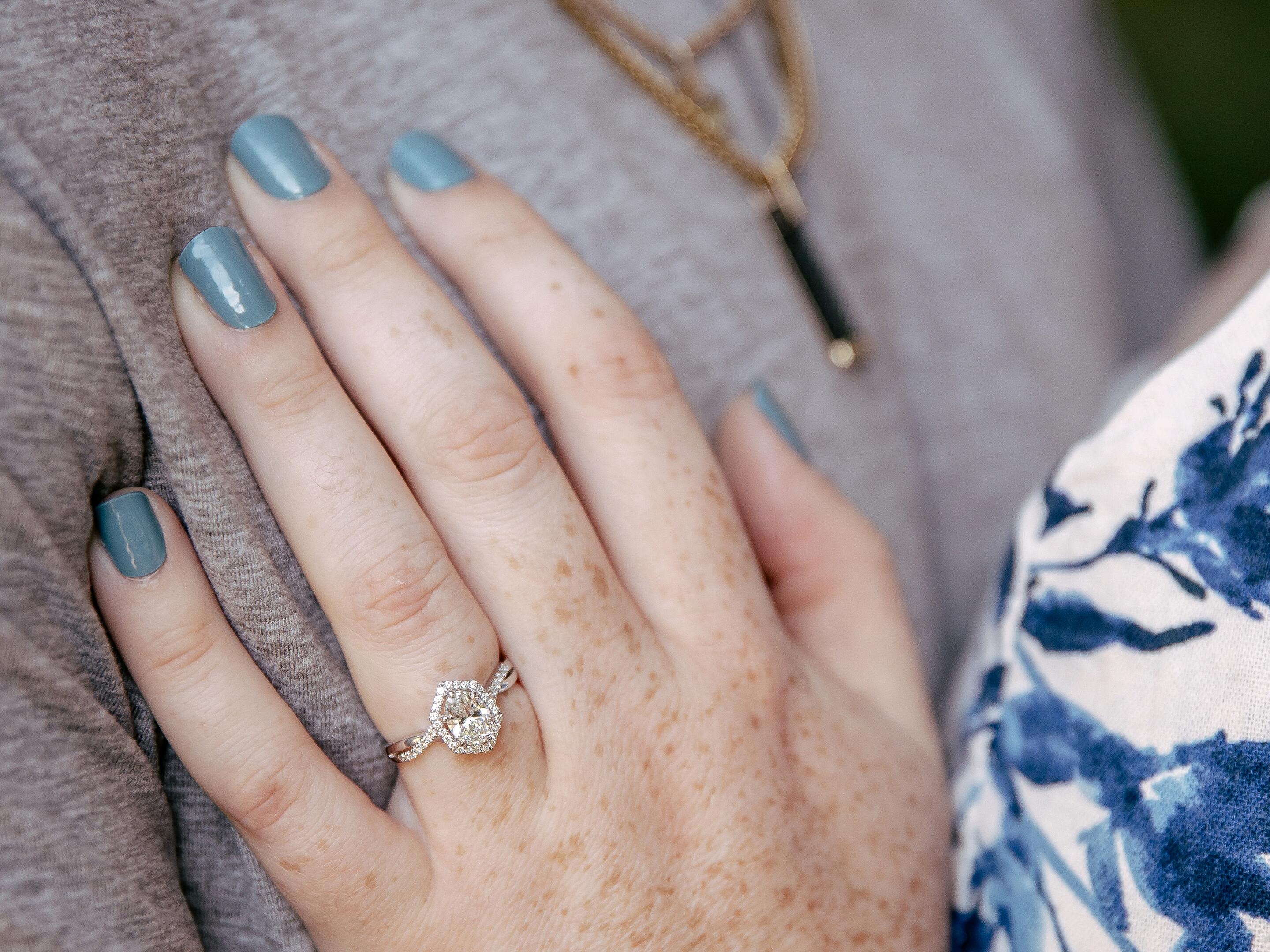 He couldn't have done better if he tried! The ring is a custom we came up with after we went looking one day. I couldn't put down a ring that was the idea behind the center stone and halo. The band is from another ring I loved that is both simple and glamorous. 
