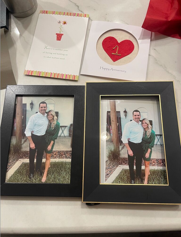 For their one year anniversary, as a part of their gifts, Alex and Emily hilariously gifted each other the same framed photo.