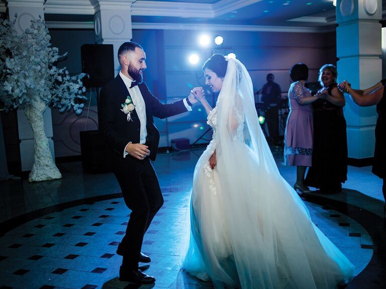 Couple enjoying their first dance in the spotlight