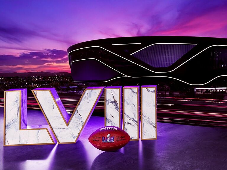 Super Bowl LVIII letters in front of Las Vegas Allegiant Stadium with football