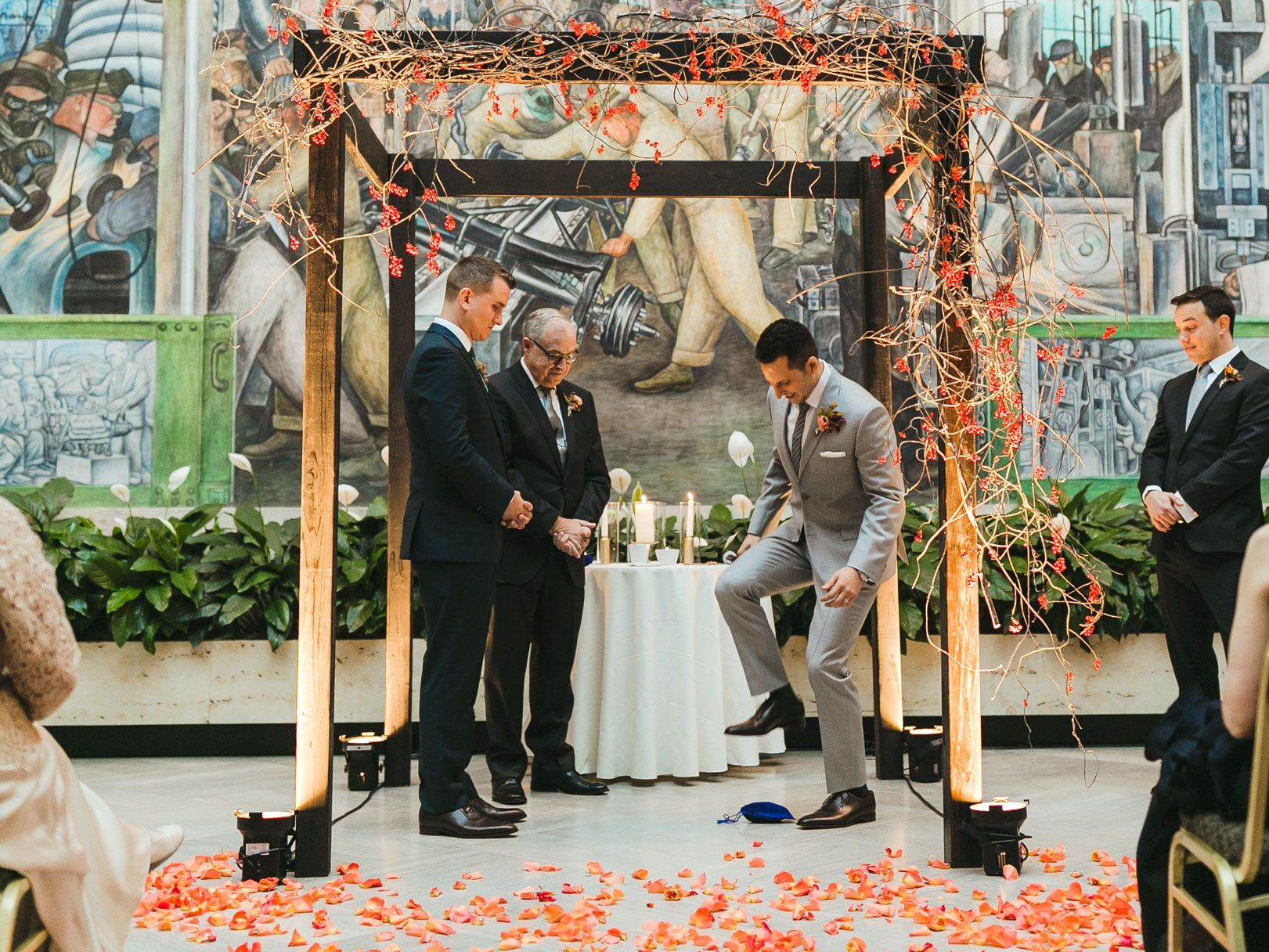Jewish wedding ceremony grooms smashing glass under chuppah