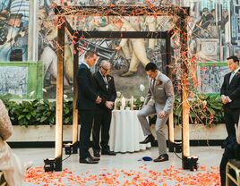 Jewish wedding ceremony grooms smashing glass under chuppah