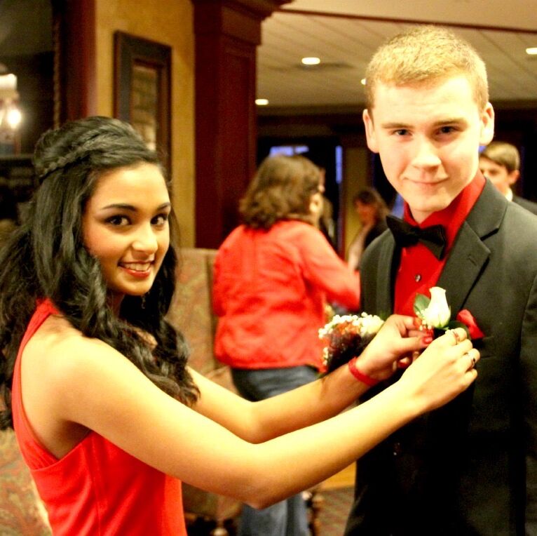 Matching red and black outfits for our freshman-year Sweetheart dance! We had a fun night of dancing with our friends.