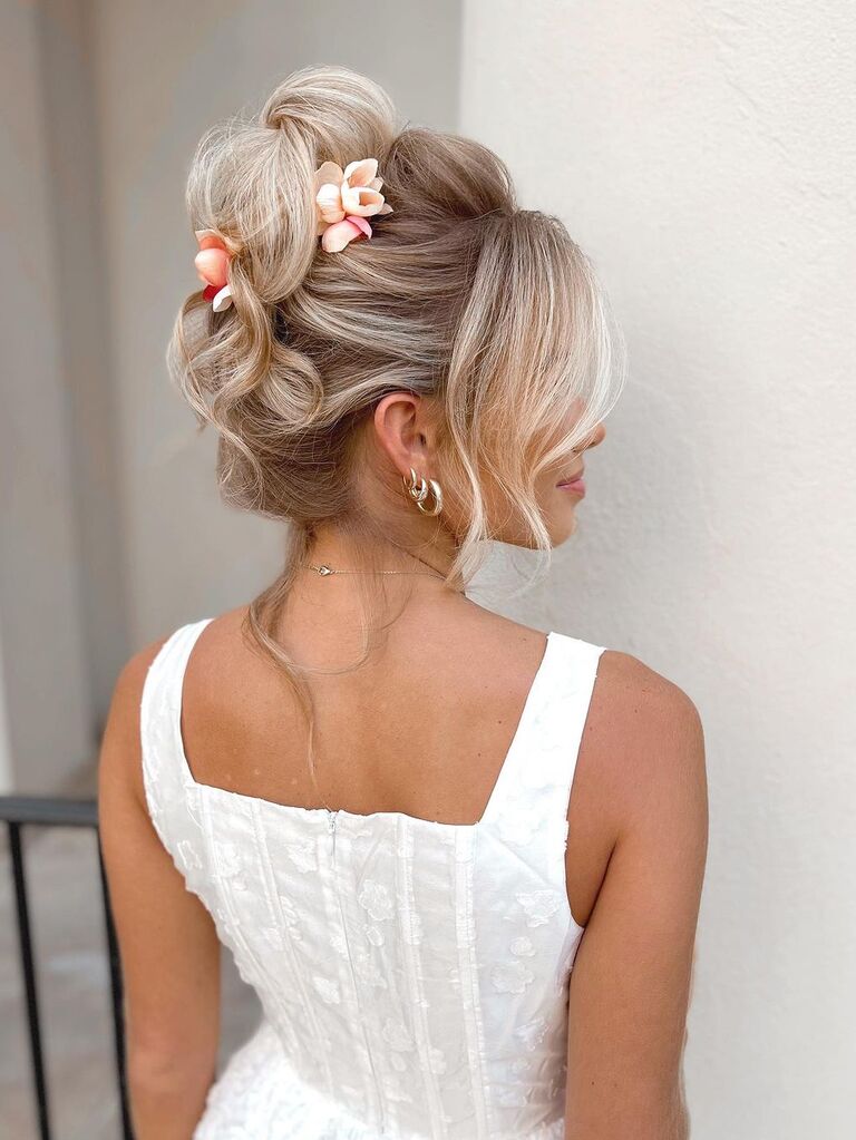 Wedding updo with flowers for long hair