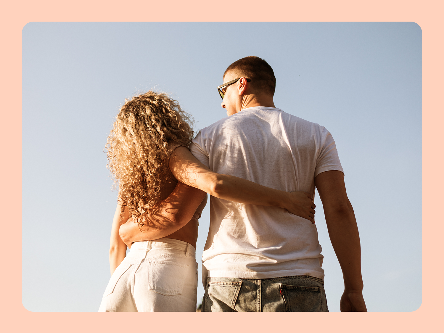 Couple smiling and looking at engagement ring, how to know if you're ready for marriage