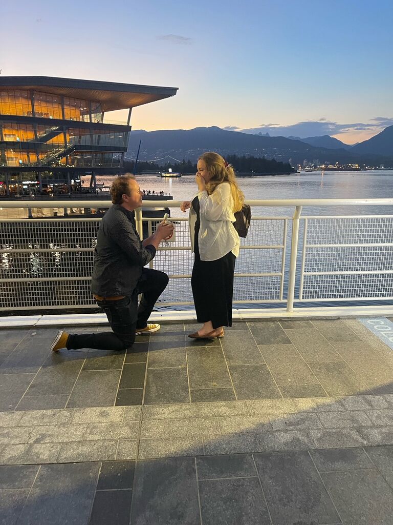 Just one day after his 30th birthday celebrations, Adam popped the question outside Canada Place in Vancouver. Even though she personally picked out the ring and had commented what a lovely day it was for a proposal only hours earlier, Naomi was TOTALLY surprised. Incredibly, the two were photographed by a curious passerby (thanks Mona). 