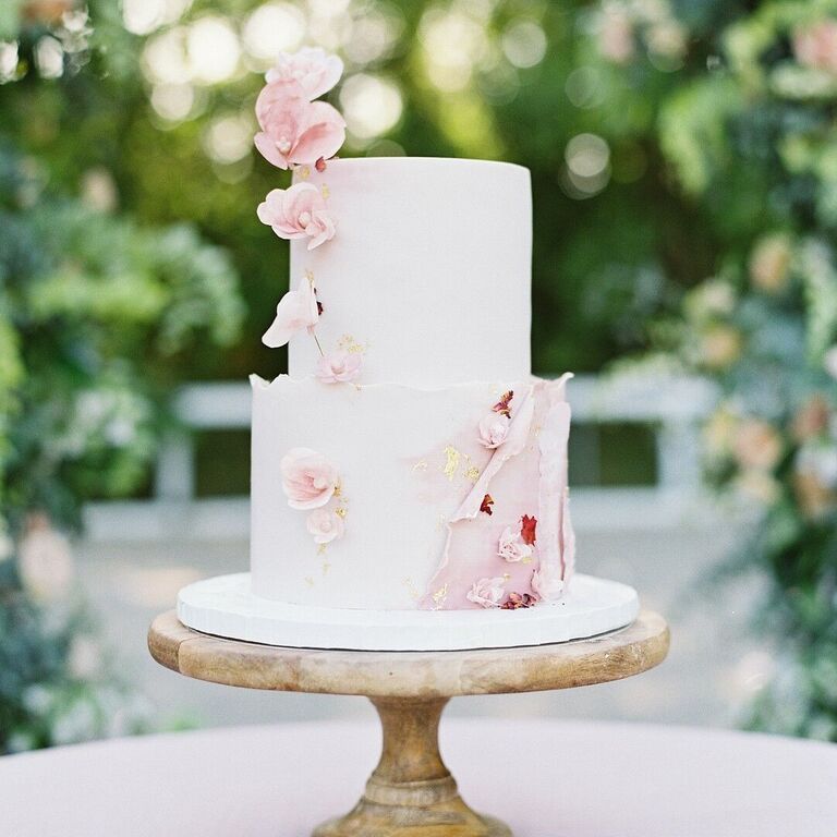 Romantic two-tier wedding cake with pink flowers