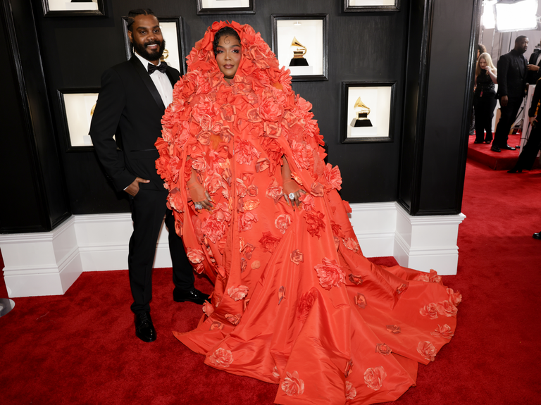 Lizzo and Myke pose at the Grammy Awards. 