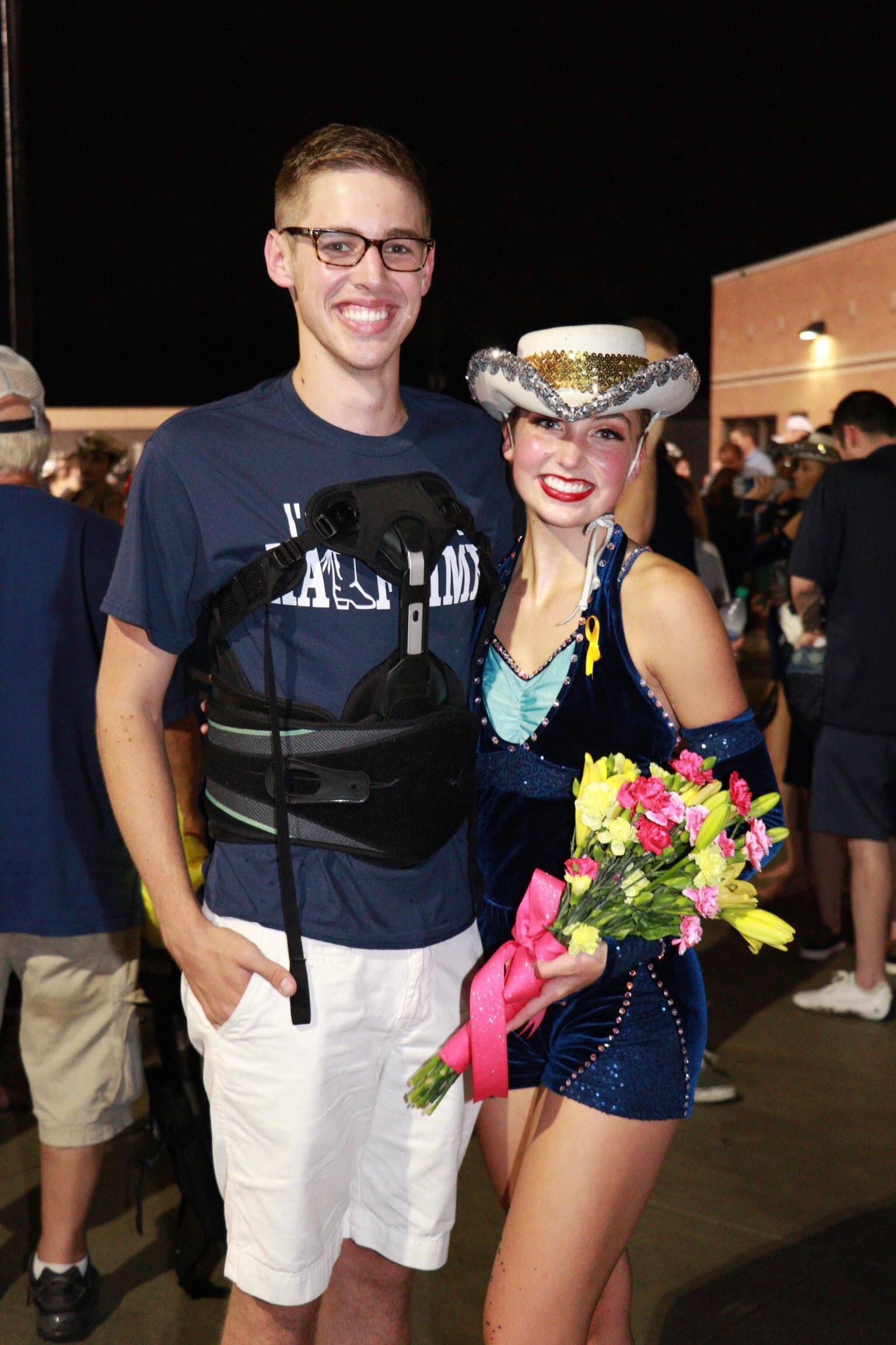 Brock surprised Maddie with flowers and no wheelchair! Her first time seeing him walk after breaking his back. 