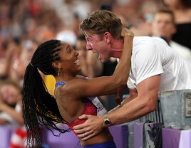 Tara Davis and husband Hunter Woodhall at the 2024 Olympics