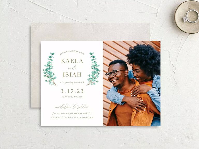 Eucalyptus graphics framing couple's names and personalized photos on right 