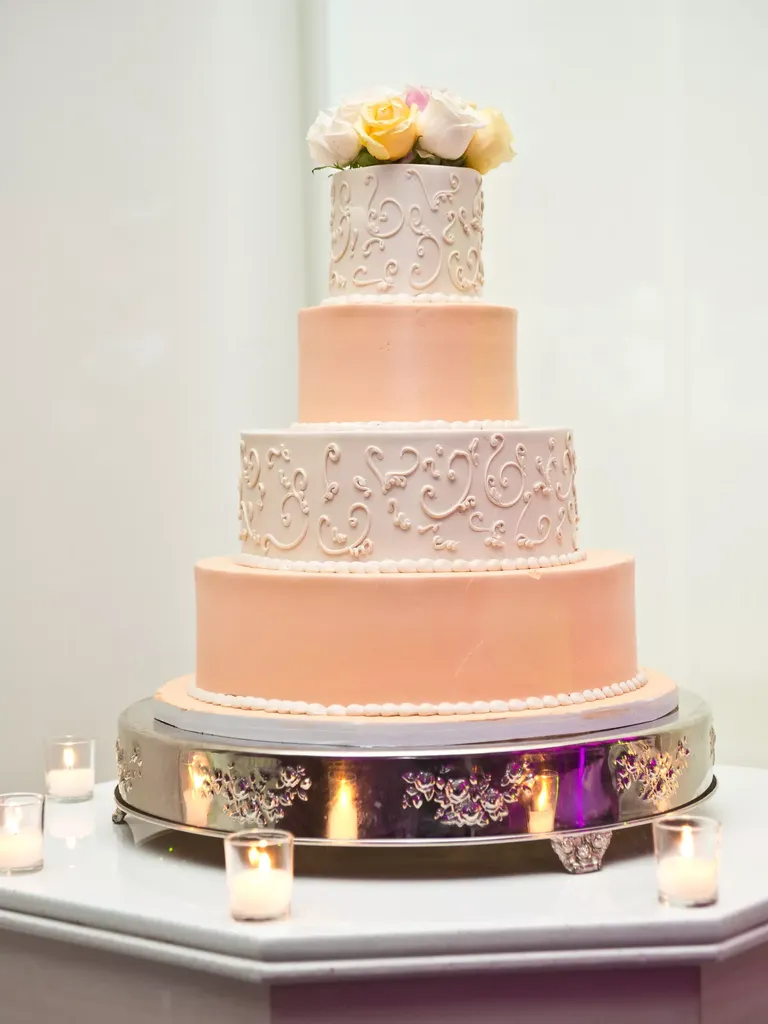 White and Peach Four Tier Wedding Cake