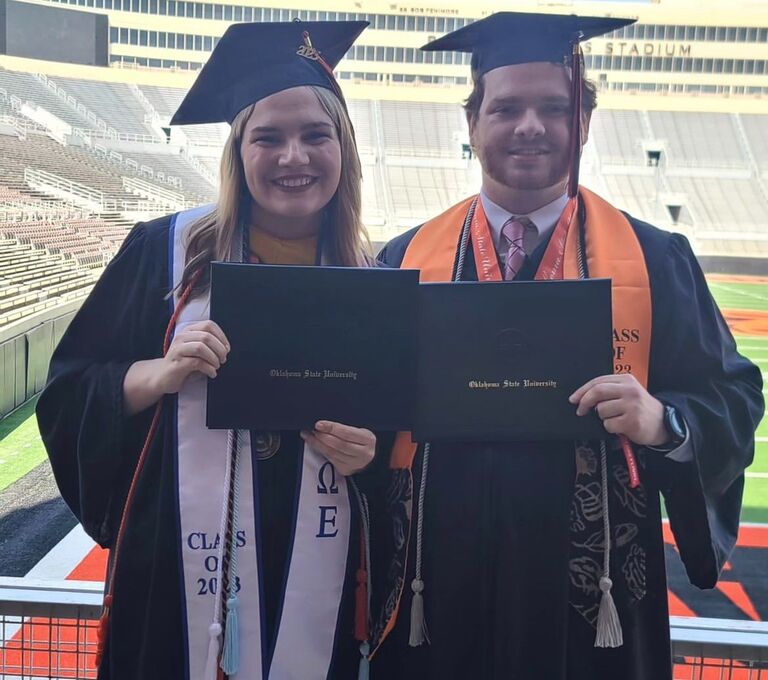 Graduation Day! Zac graduated with two degrees in mechanical and aerospace engineering. Alyson got hers in chemical engineering. Since they were in the same college they got to walk together and take a picture in front of the field. 