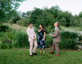 Guests laughing with each other at outdoor rehearsal dinner venue