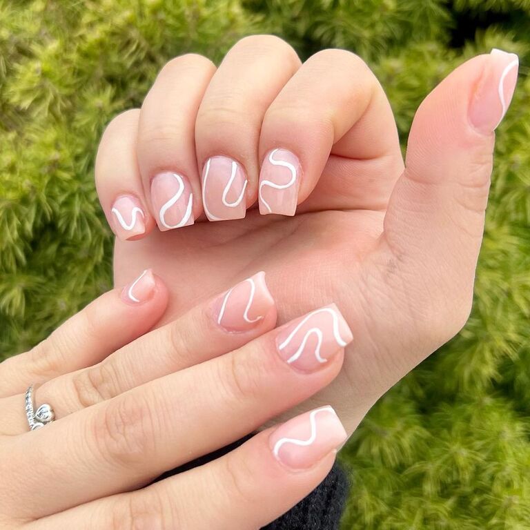 Thin white swoops bridal nail inspiration