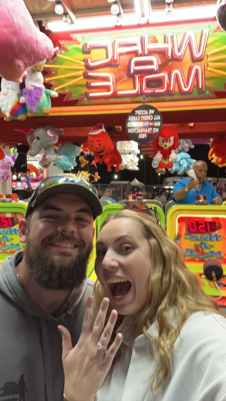 Lexie let Dustin win Whac-A-Mole and then he PROPOSED