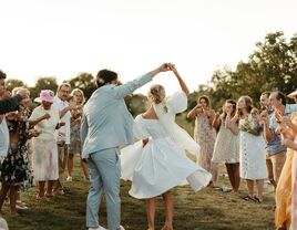 Couple and guests at summer wedding