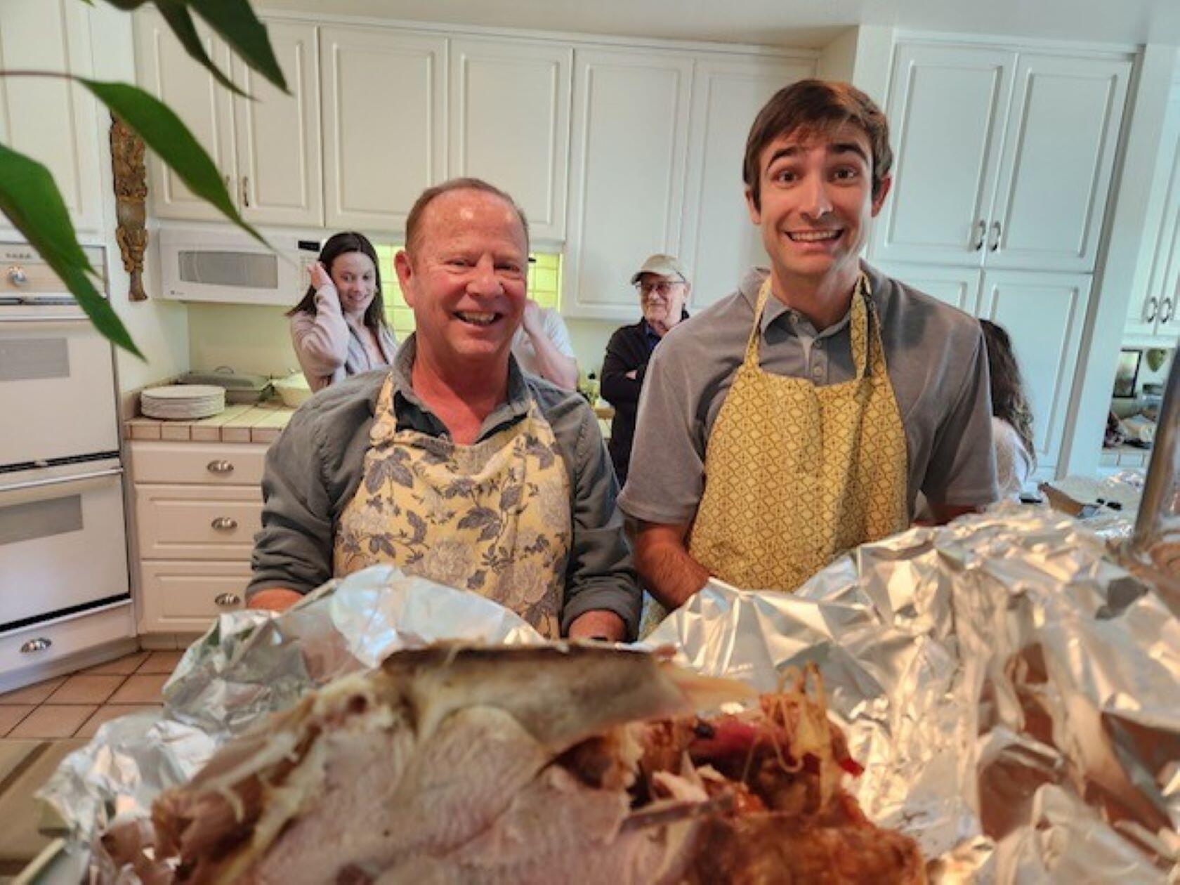 Hunter learning how to carve a turkey from the best!