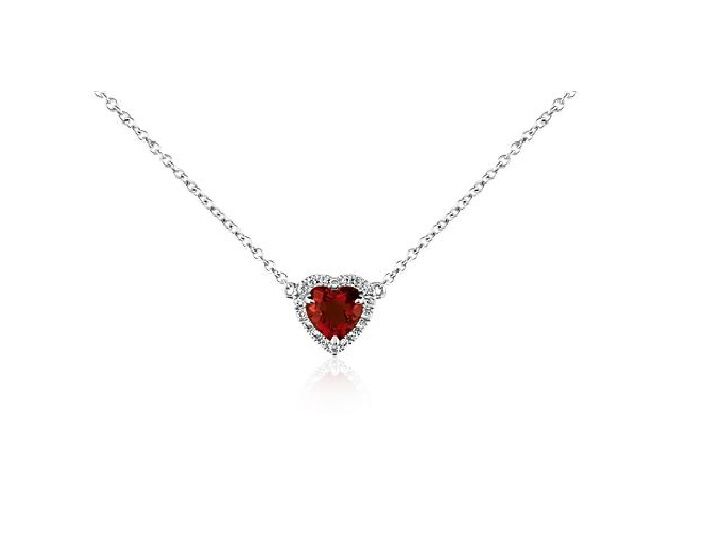 Silver necklace with a ruby heart gem and diamonds