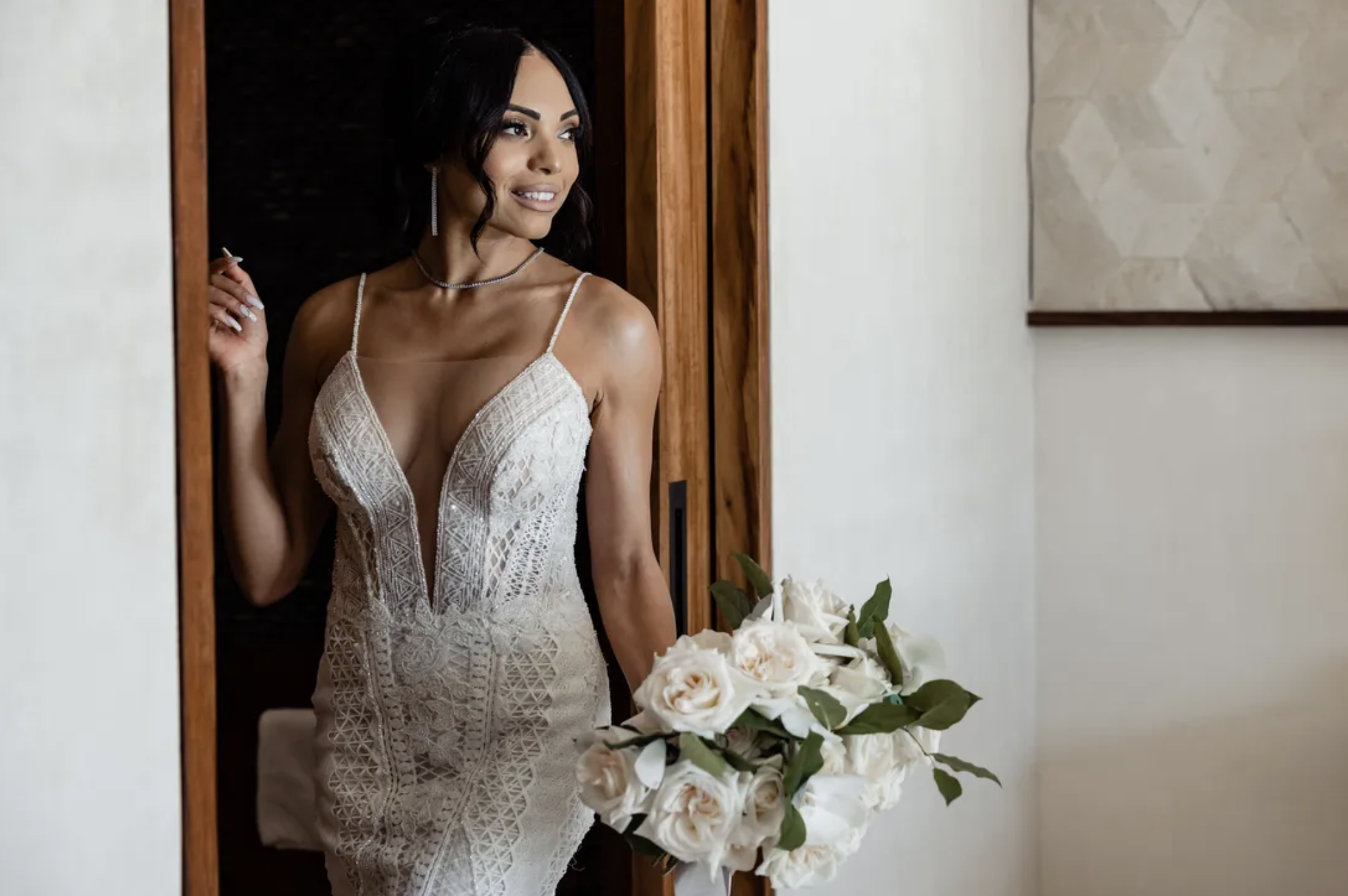 Bride posing in wedding dress