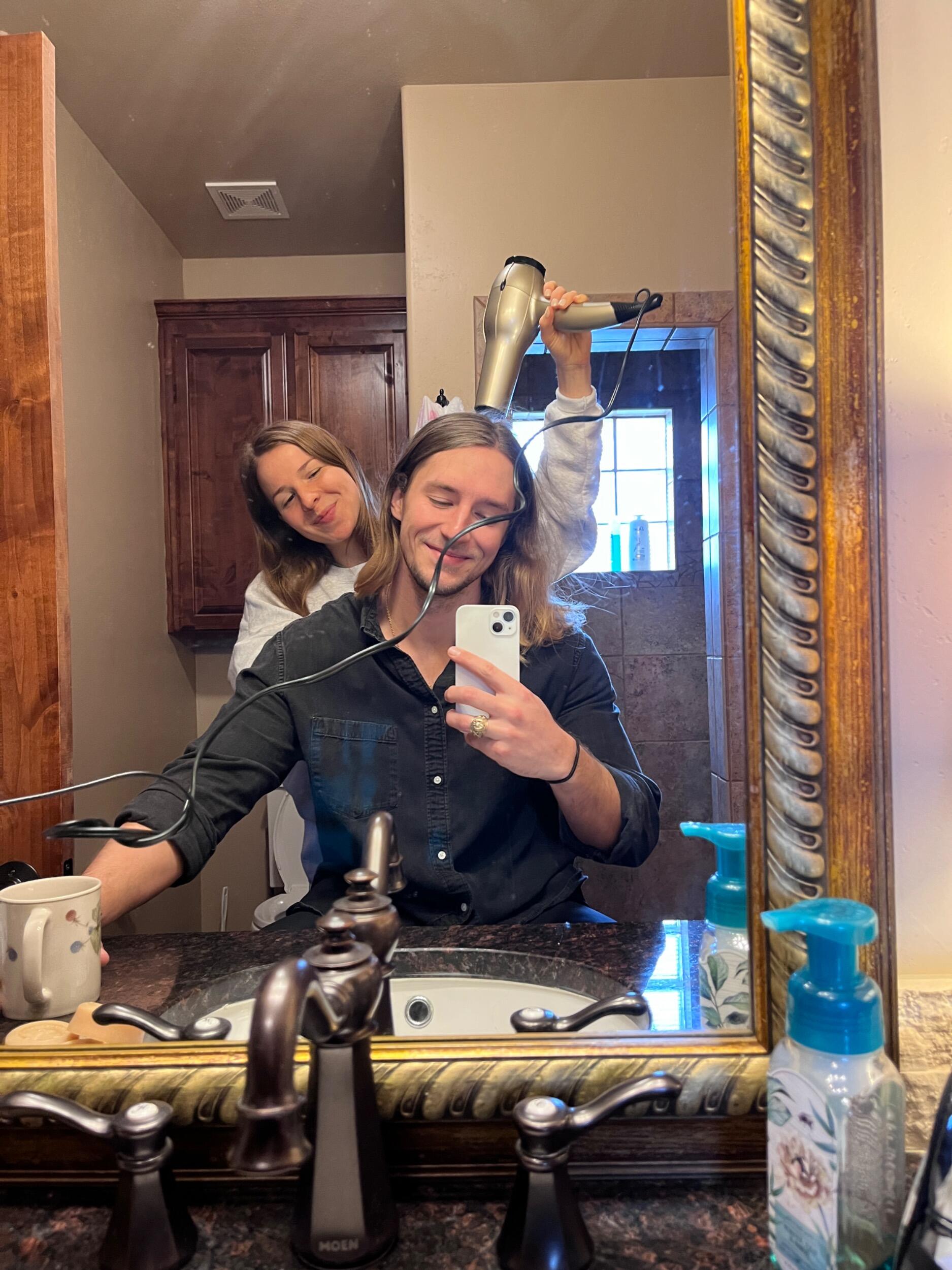 Em teaches Ev how to live with long hair.