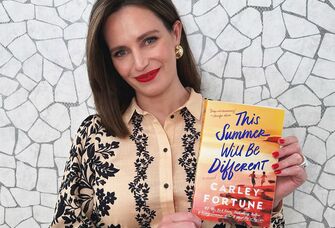 Author Carley Fortune holding her new book This Summer Will Be Different