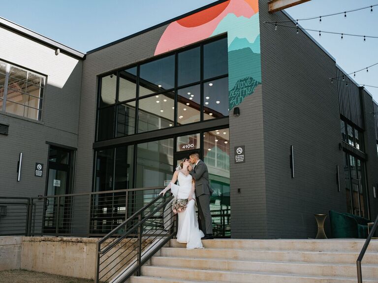 Couple kissing outside the venue