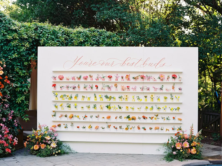 Flower Vase Escort Card Wall in springtime shades