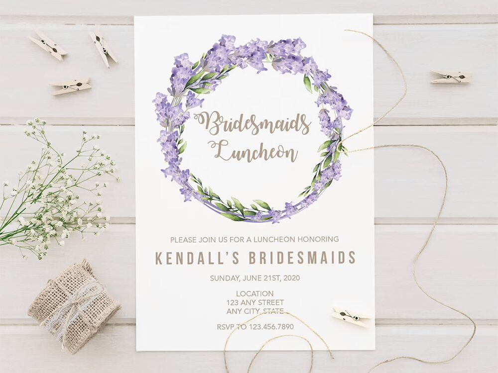 Purple flower and greenery wreath with playful gold type on white background