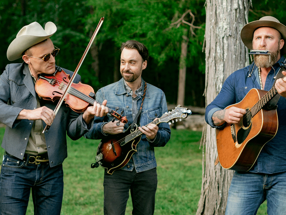 Three country musicians playing at a wedding ceremony. 