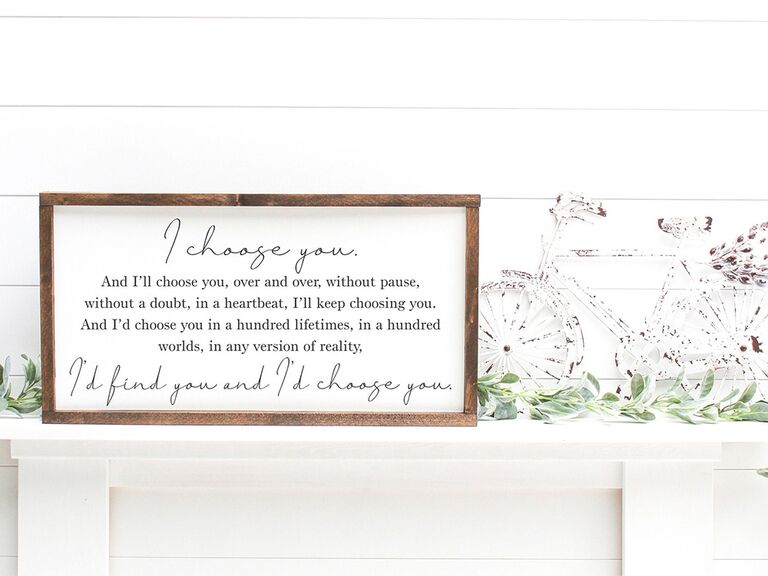 'The Notebook' quote in black minimalist type on white background in wooden frame