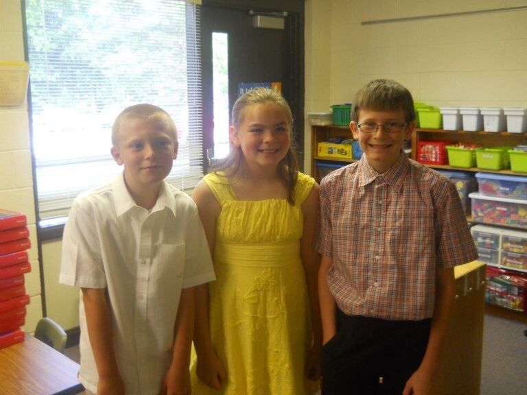 Best friends in elementary school who are celebrating 5th grade graduation