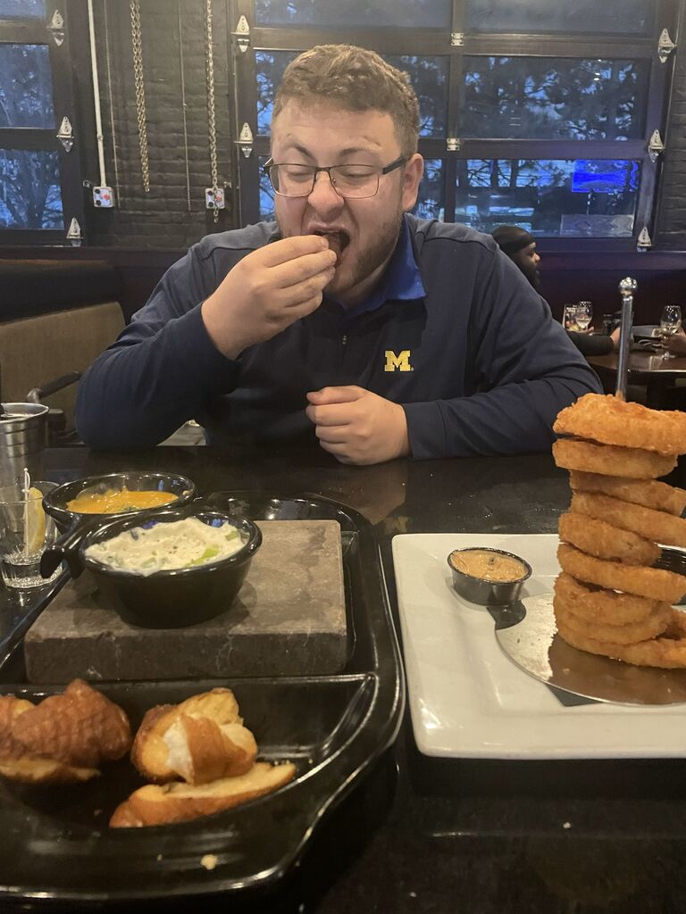 Not only do Alexis and Michael enjoy sports, they also enjoy really good food and dinner dates. Big fan of the onion rings. 