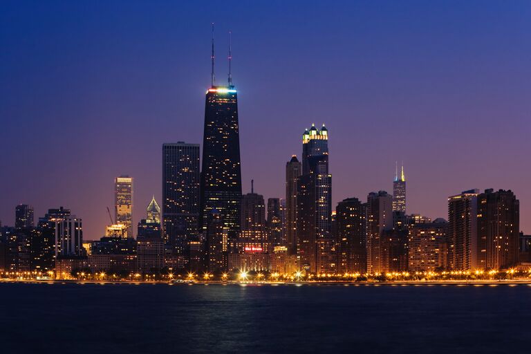 chicago skyline twinkles at dusk 