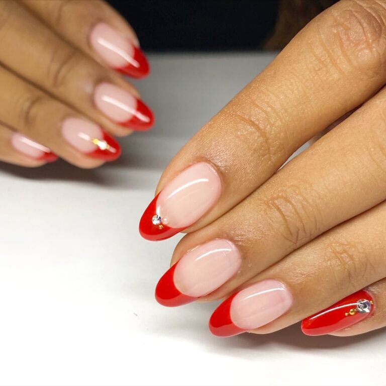 Red French manicure wedding nail trend with jewels