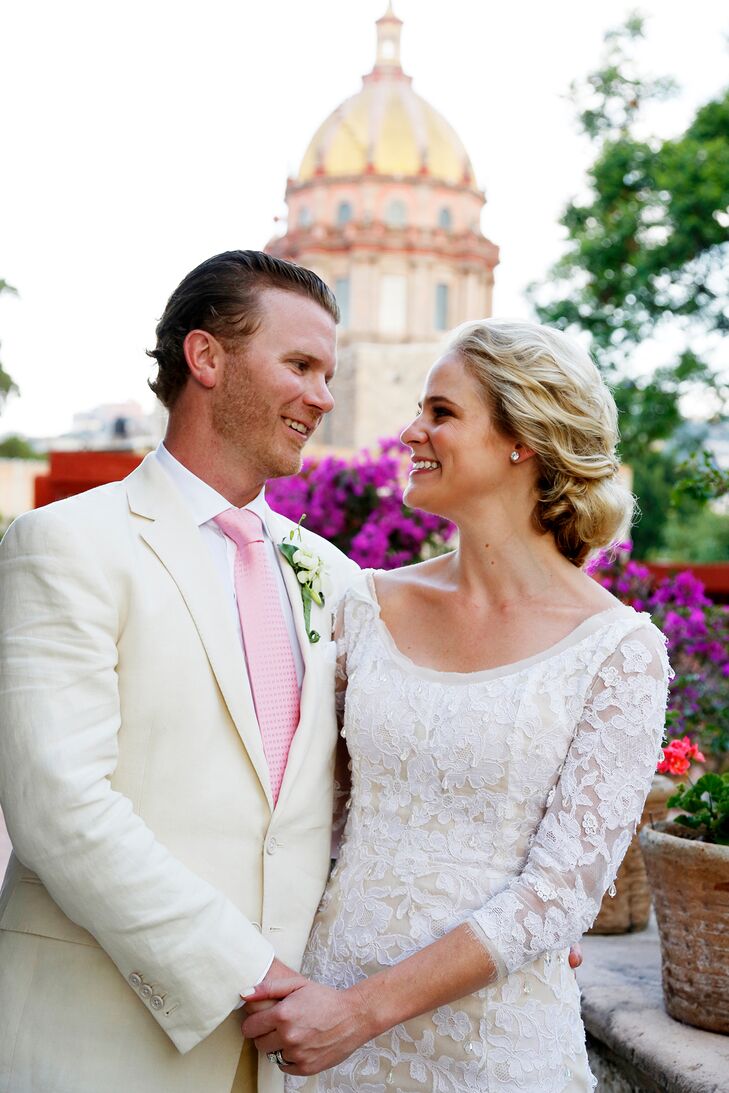 ivory wedding dress and white groom shirt