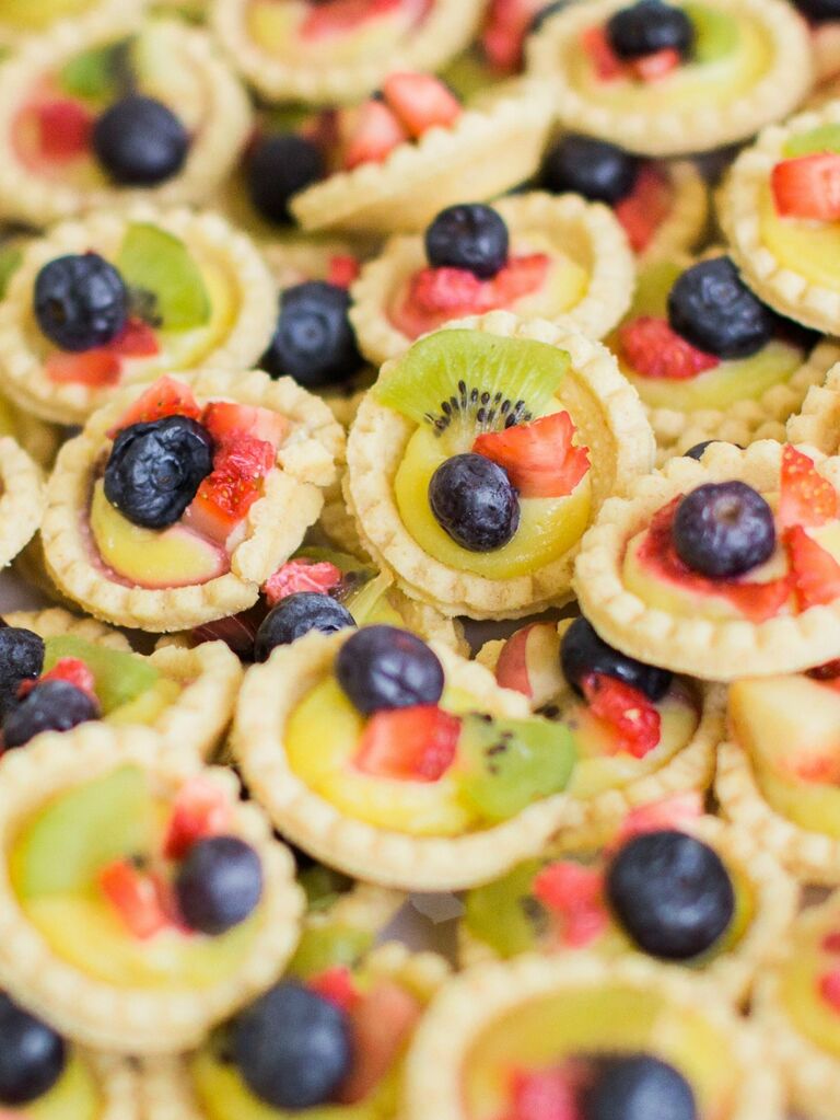 Mini tarts topped with fresh fruit. 